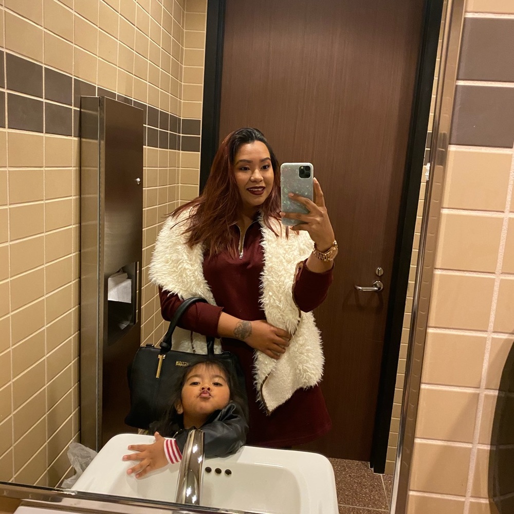 White sleeveless sweater